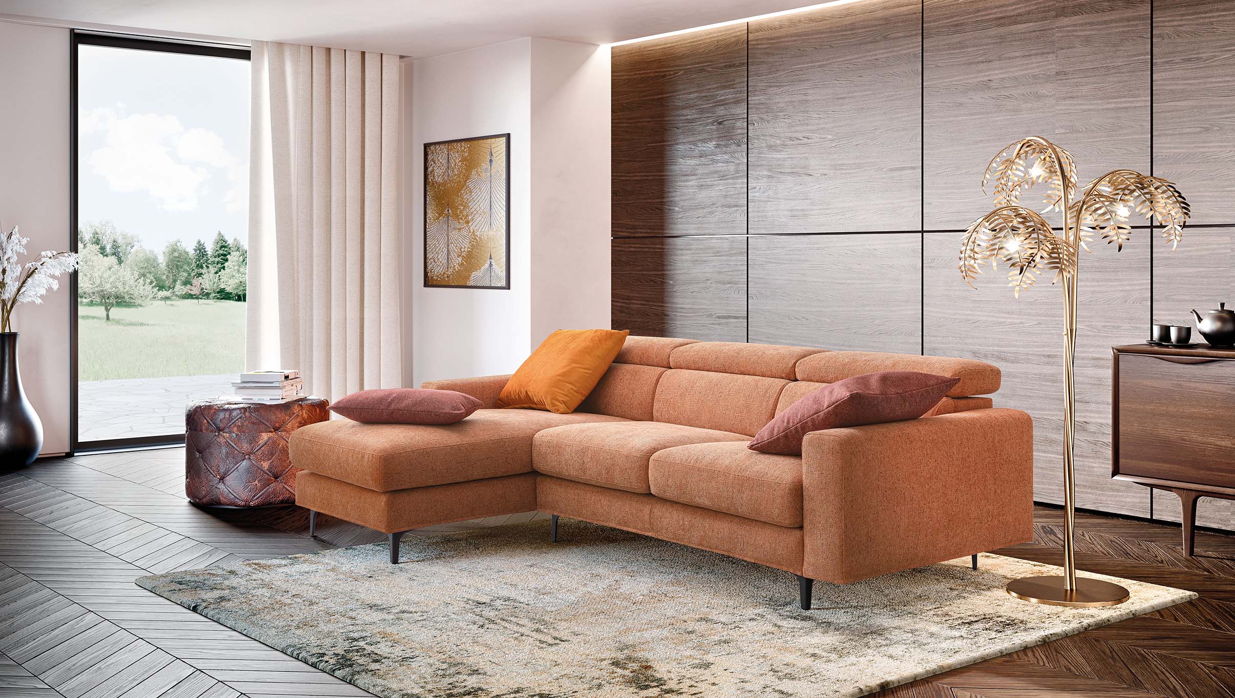 Divano Argo moderno in un soggiorno moderno. Piedini alti, poggiatesta regolabili e chaise longue.