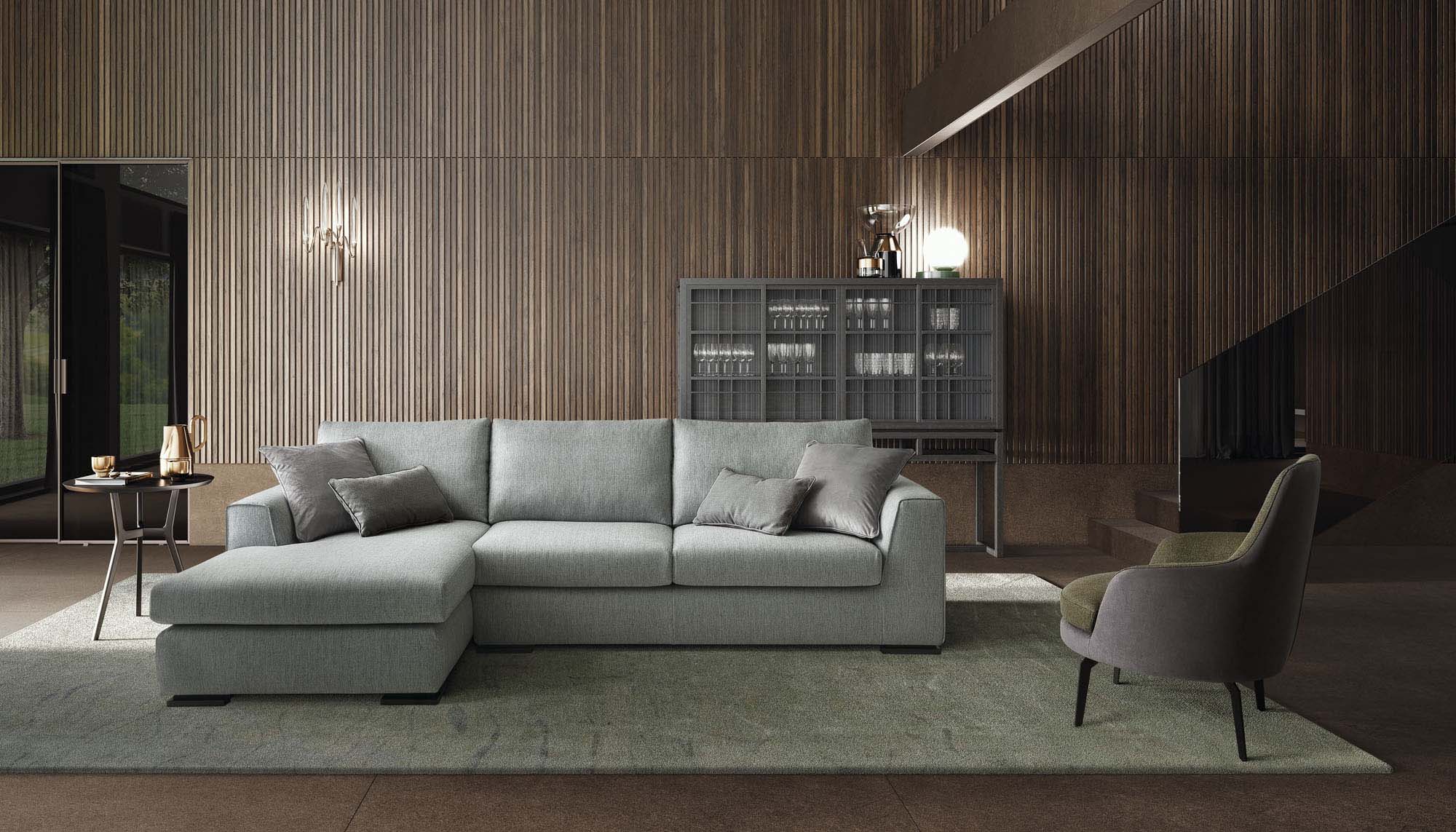 Soggiorno in legno moderno arredato con divano moderno basso a penisola colore grigio-azzurro