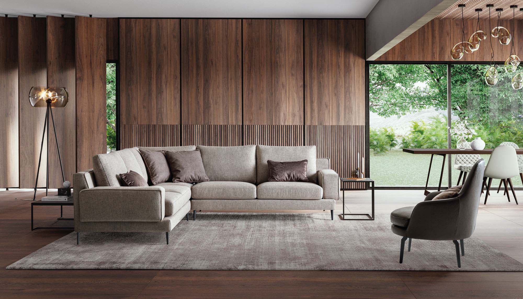 Soggiorno ampio arredato con divano angolare di design con piedini sottili