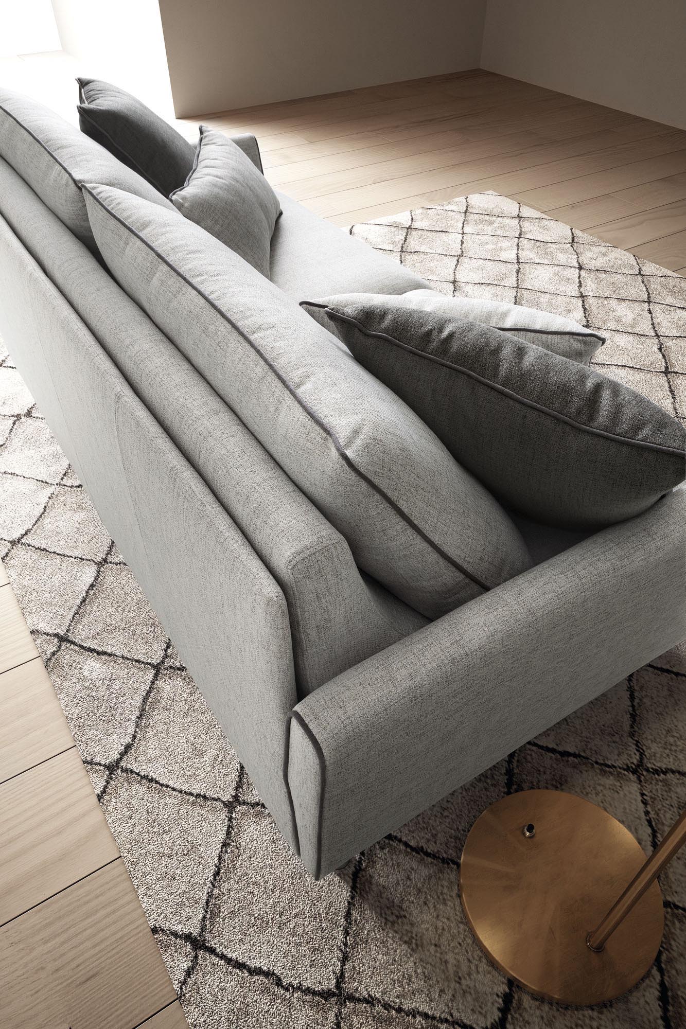Dettaglio dello schienale del divano letto Bali: schienale rigido con due cuscinotti ampi in appoggio e altri cuscini decorativi.