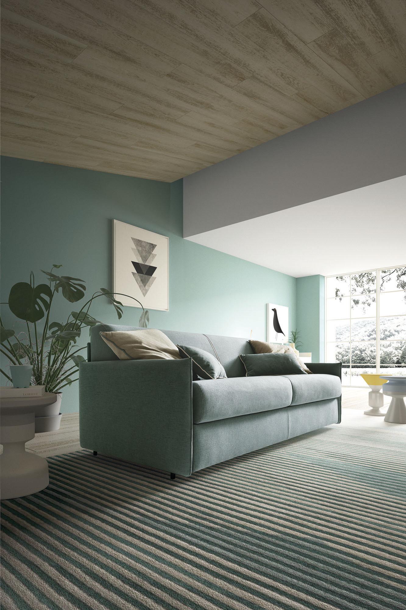Divano trasformabile in letto rivestito in tessuto sfoderabile azzurro. Stile moderno