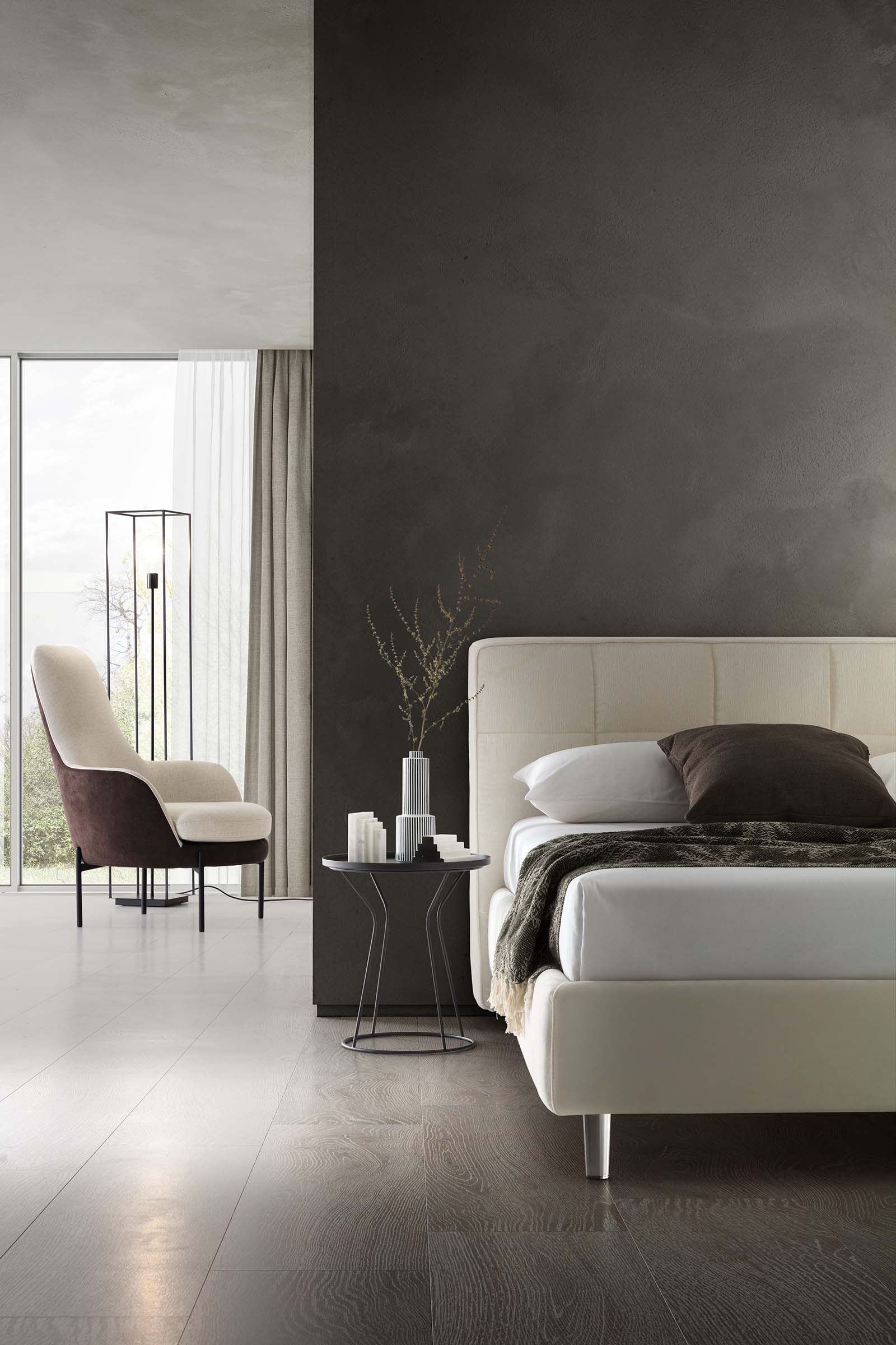 Camera da letto moderna arredata con letto bianco con piedini trasparenti alti e schienale squadrato