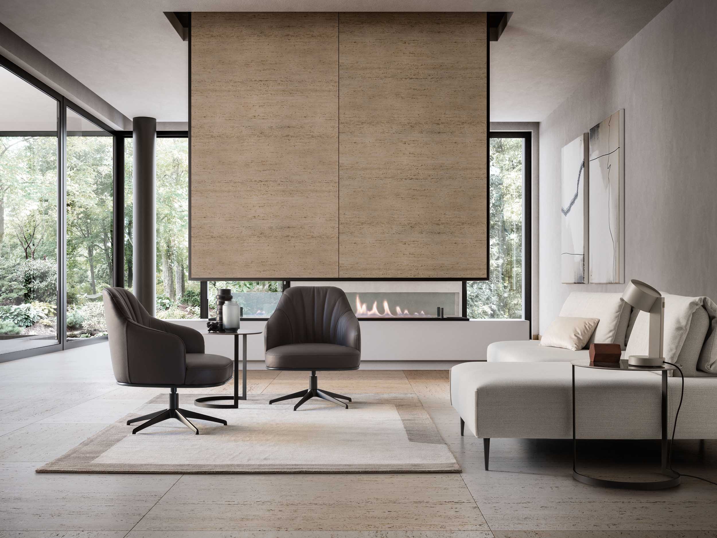 Salottino moderno con poltroncine nere girevoli su un tappeto geometrico ampio