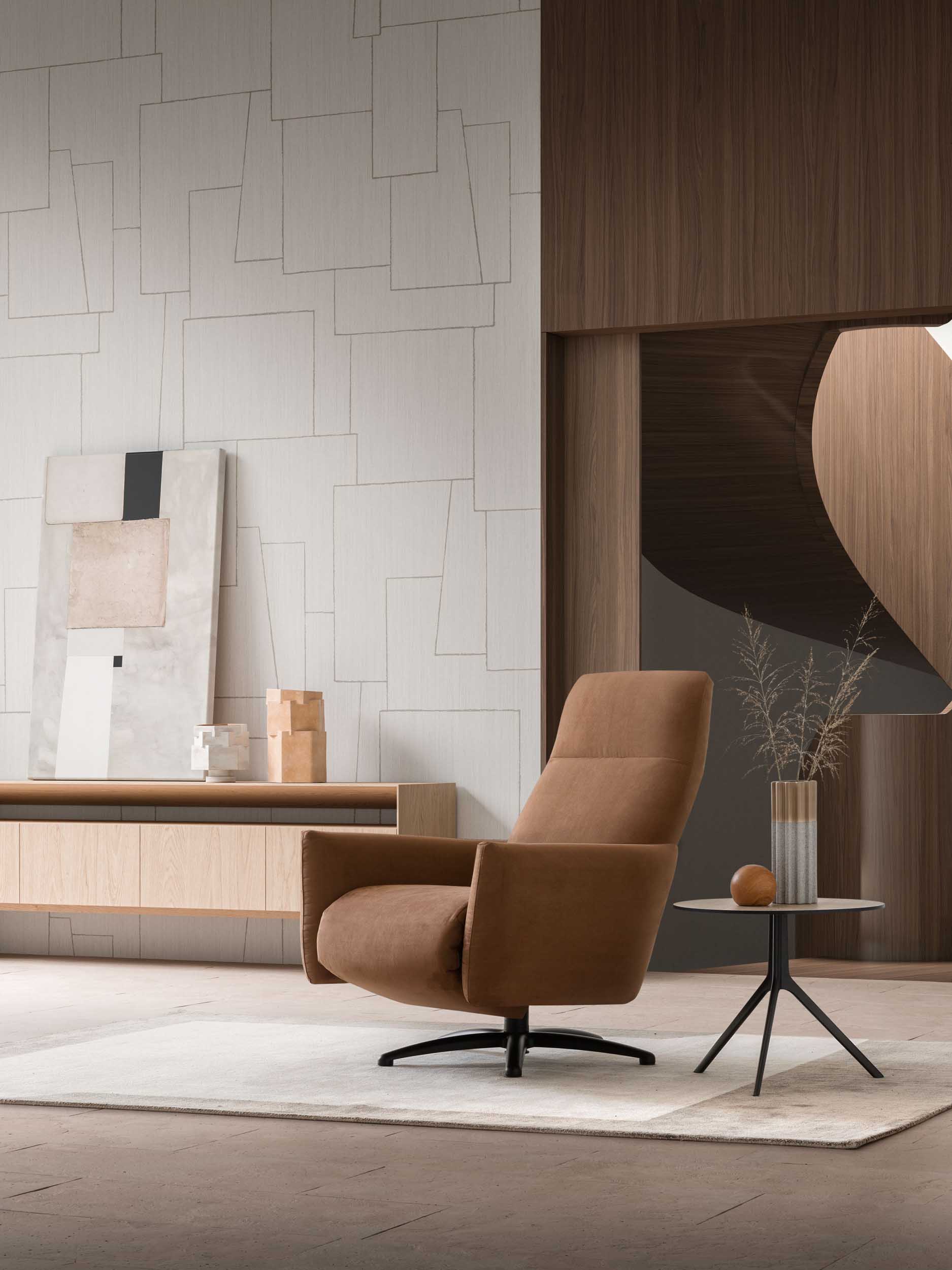 Poltrona relax comoda di colore marrone inserita in un arredamento moderno dai colori caldi